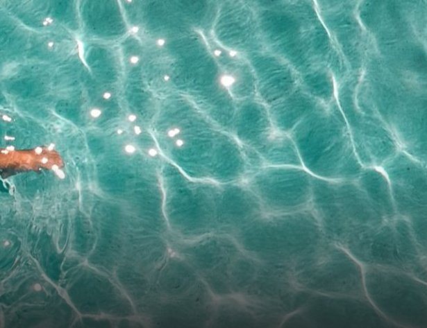 Swimming from a boat in clear water